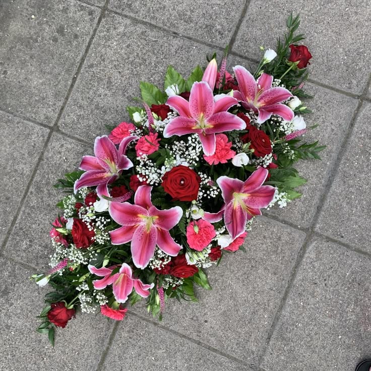 Low Long Arrangement. Lillium Carnation Rose